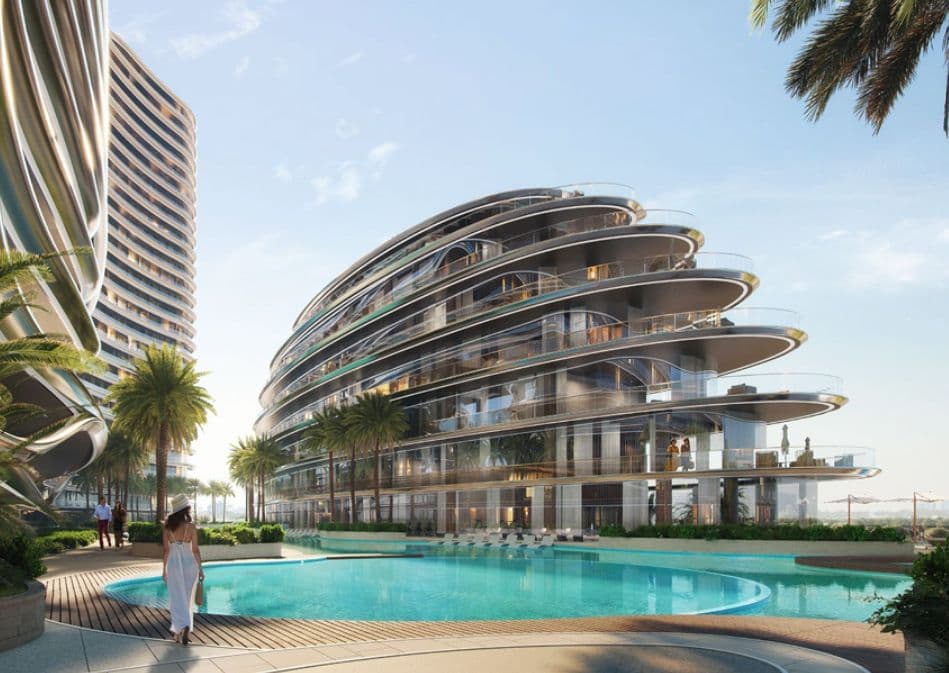 Binghatti Aquarise — the building exterior beside the pool