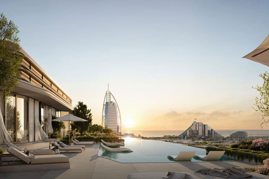 Nourelle — the infinity pool at sunset facing Burj Al Arab